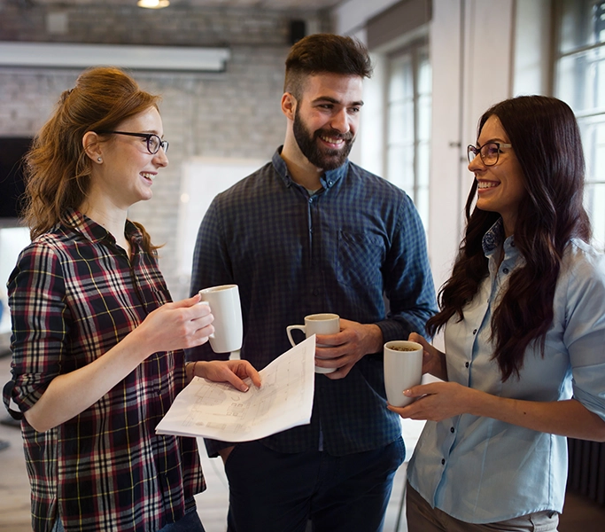 three young people drinking coffee